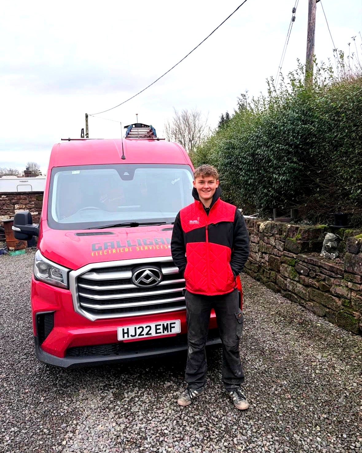 Galligan Electrical Services electrician with the branded red van